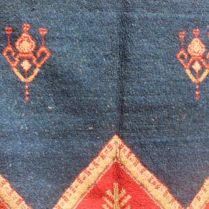 Hand-knotted Berber Amazigh Navy Diamond Rug with symbols believed to carry meaning