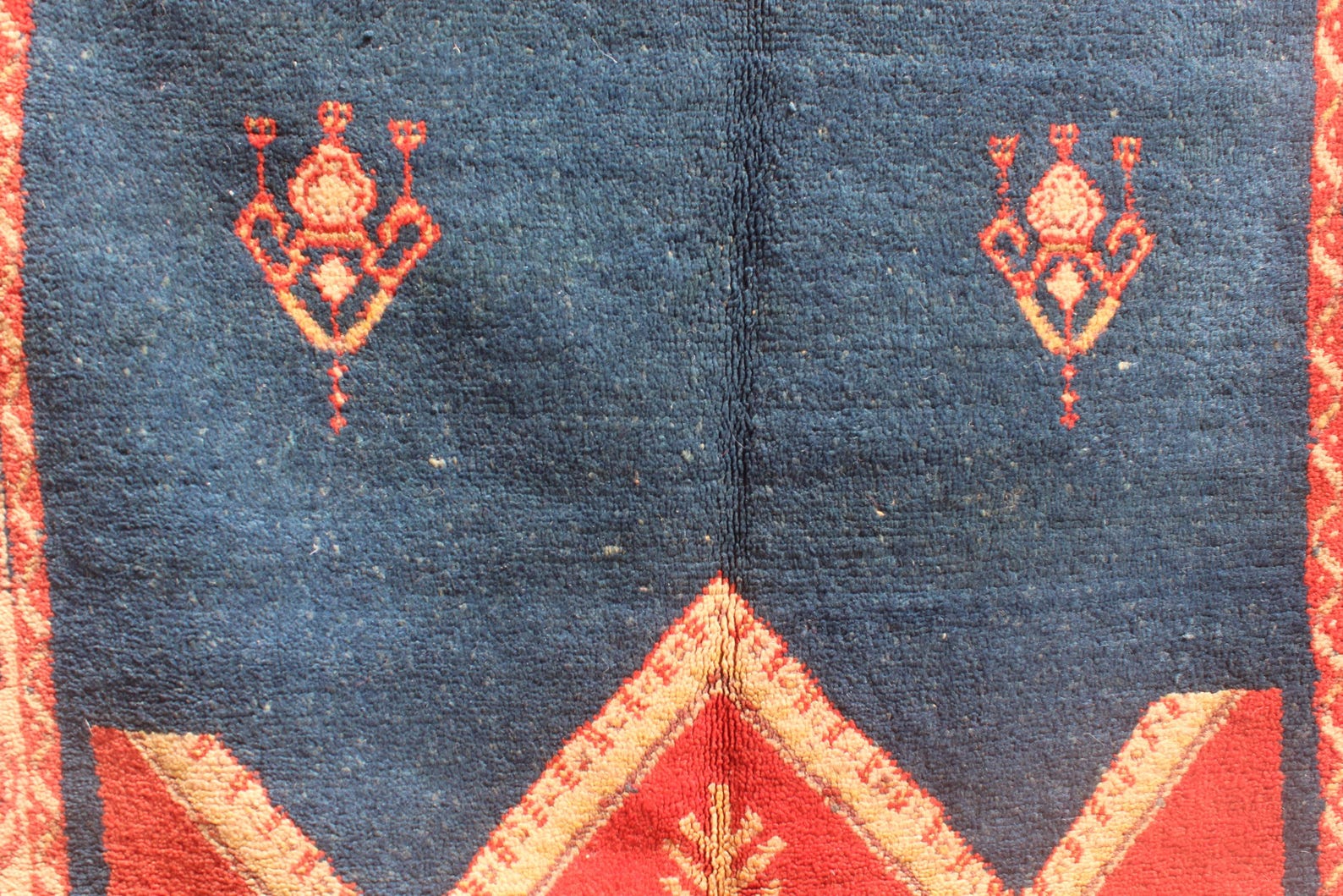Hand-knotted Berber Amazigh Navy Diamond Rug with symbols believed to carry meaning