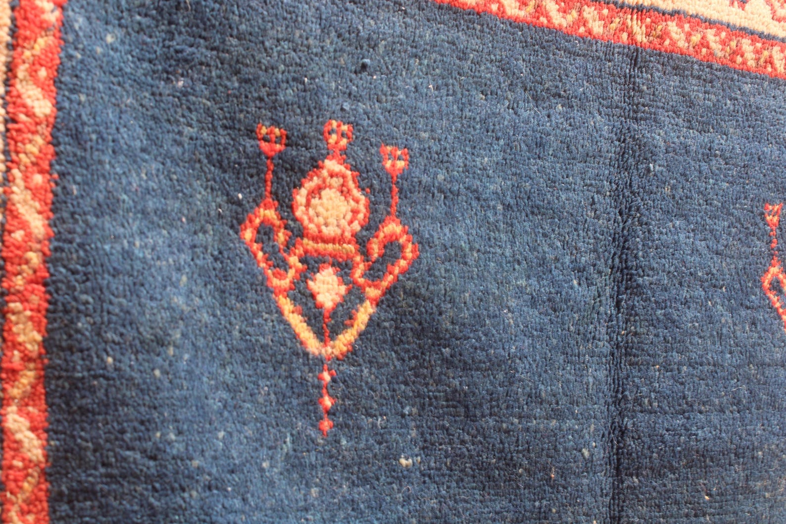 Hand-knotted Berber Amazigh Navy Diamond Rug with symbols believed to carry meaning