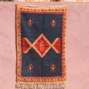Hand-knotted Berber Amazigh Navy Diamond Rug with symbols believed to carry meaning
