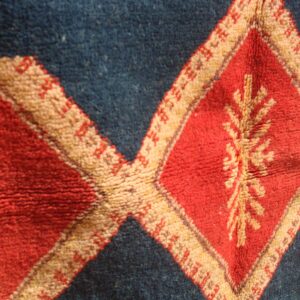 Hand-knotted Berber Amazigh Navy Diamond Rug with symbols believed to carry meaning