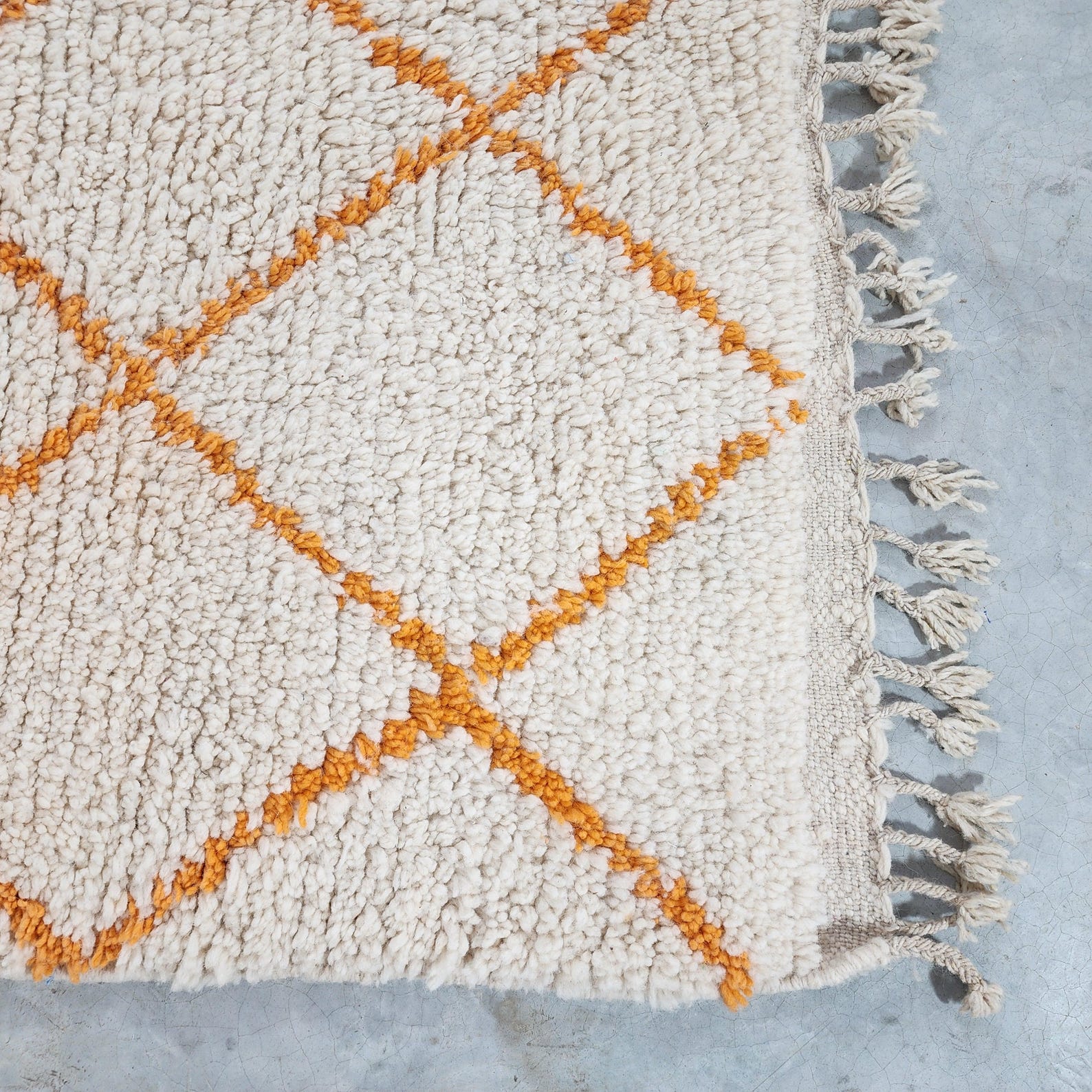 Berber Care Handmade White Wool Rug with Orange Design