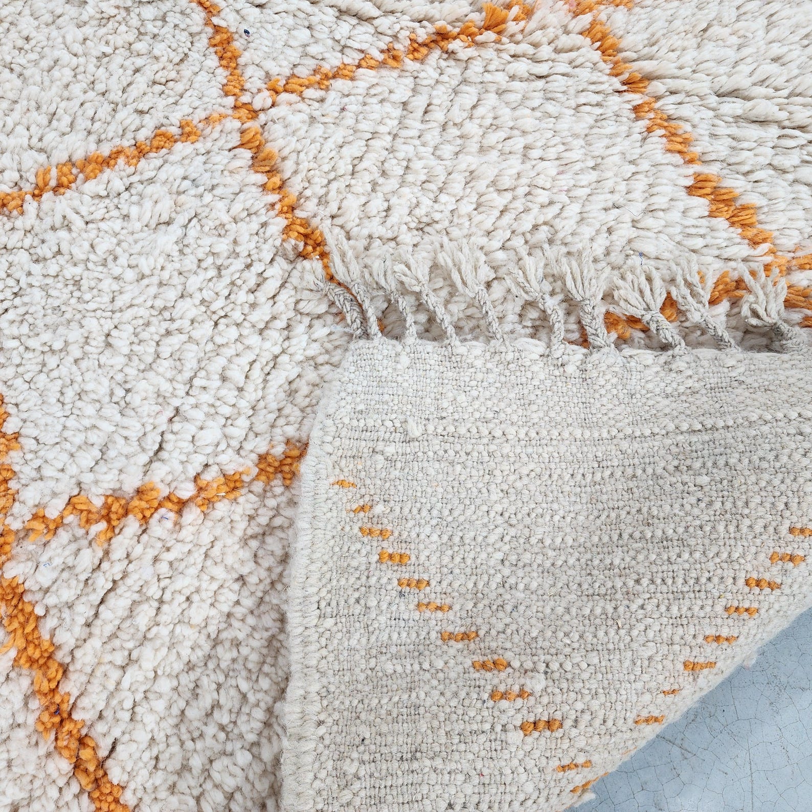 Berber Care Handmade White Wool Rug with Orange Design