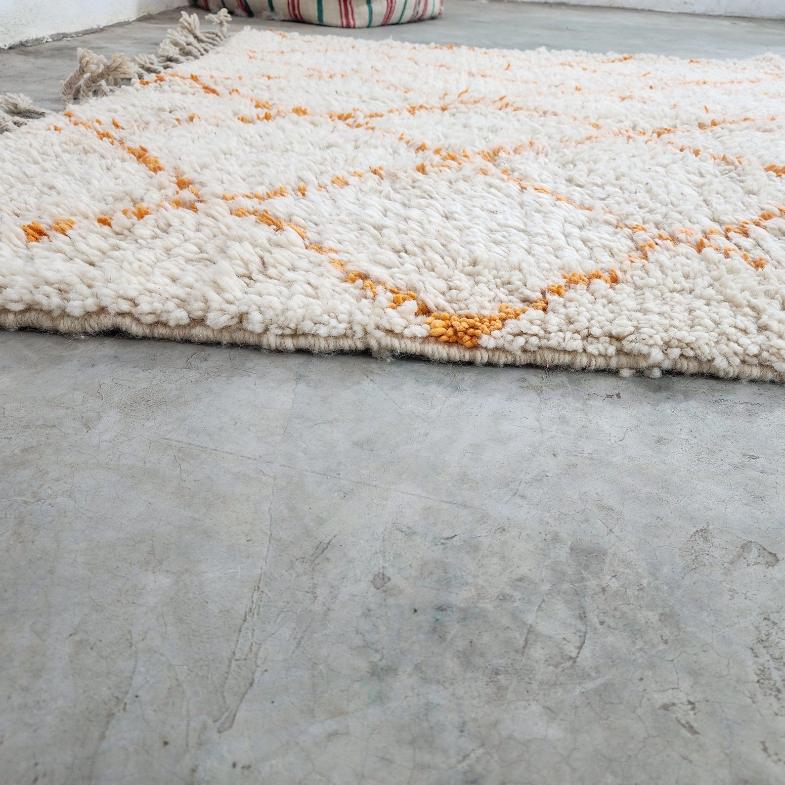 Berber Care Handmade White Wool Rug with Orange Design